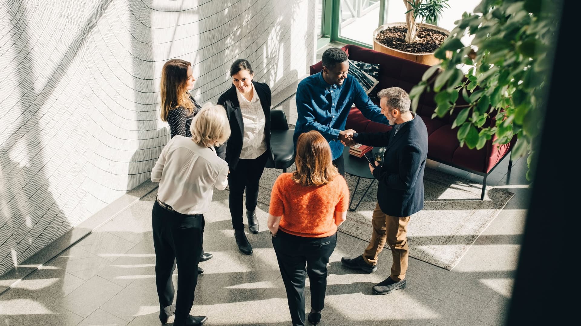 High angle view of multi-ethnic business people greeting at conference