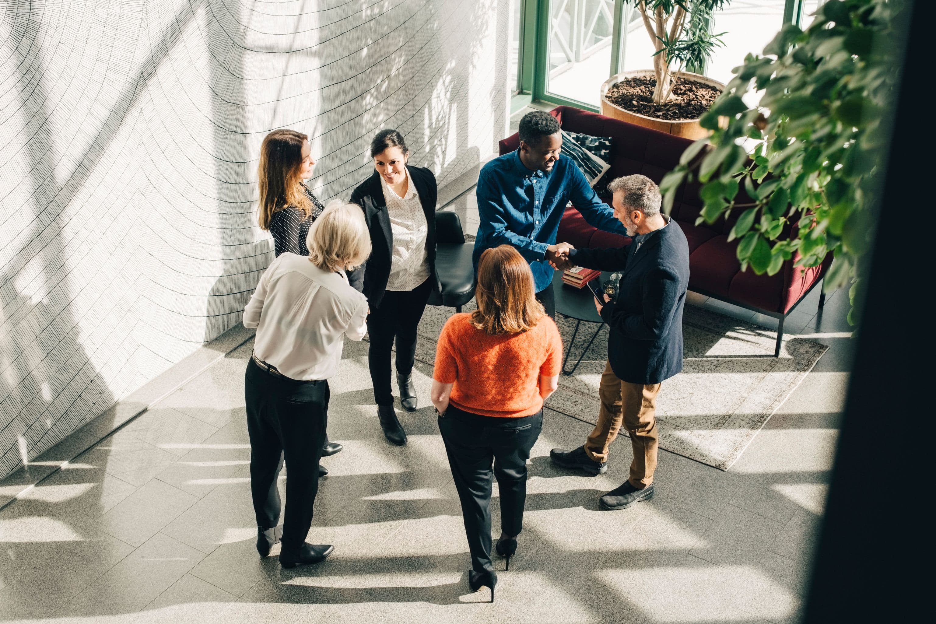 High angle view of multi-ethnic business people greeting at conference